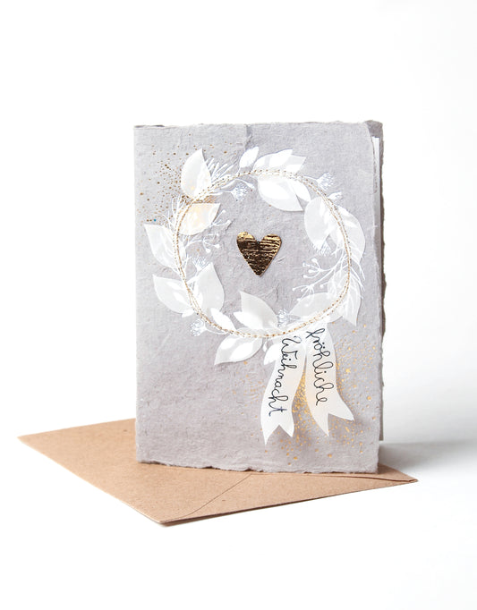 Winterpapierkunstkarte. Herzkranz