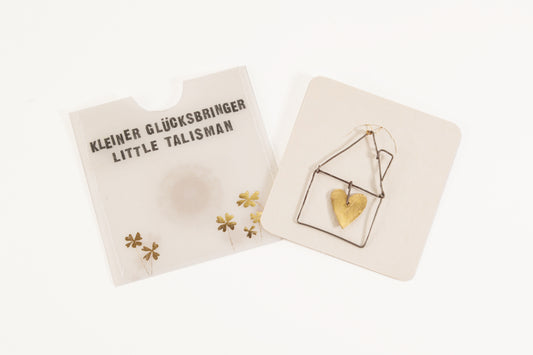 Kleine Goldglücksbringer. Haus