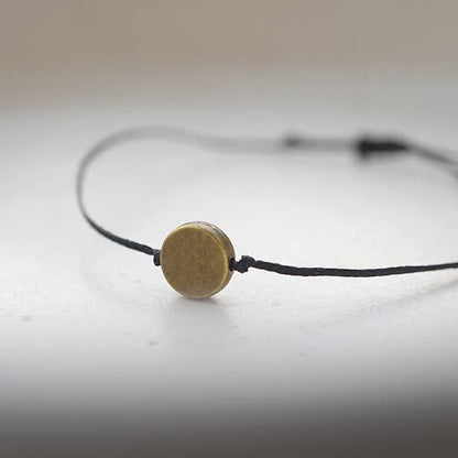 DOT Armband: Braun