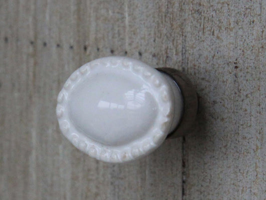 Möbelknopf altweiß oval mit Perlenkante